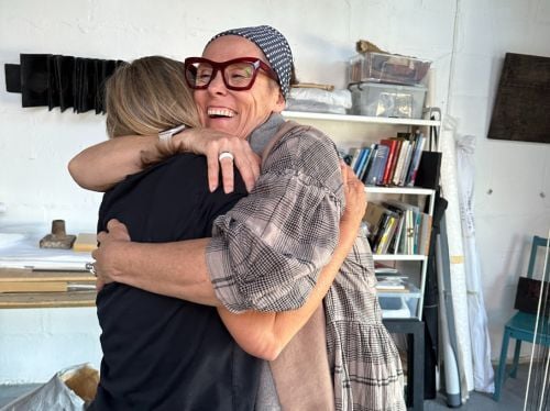 Behind the scenes - Debs hugging an artist