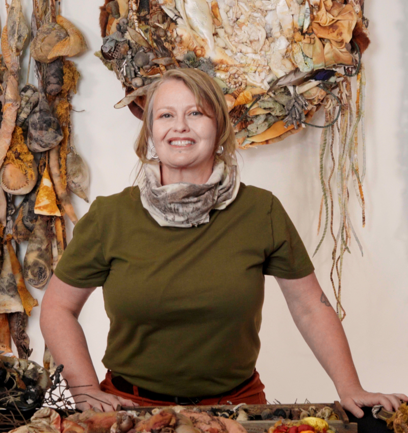 Clarissa Callesen in her studio smiling at the camera