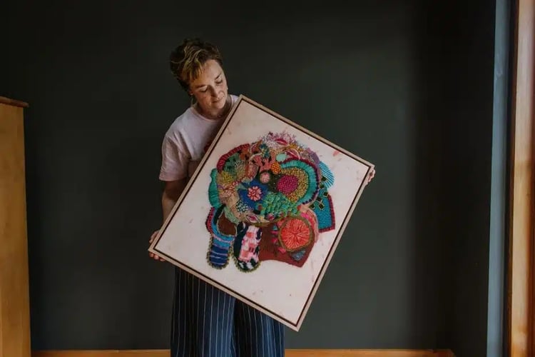 Fleur Woods with her artwork