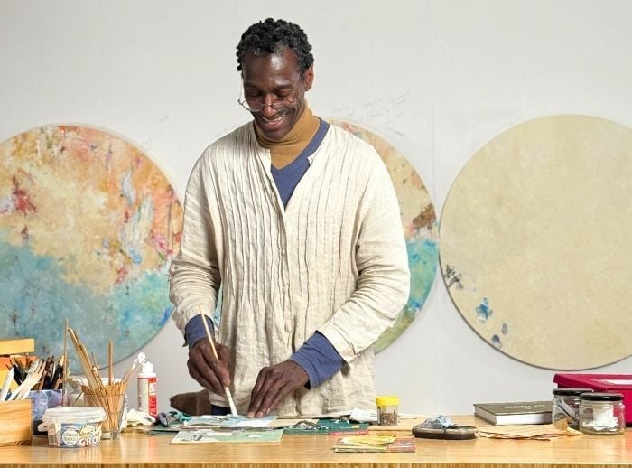 Robert Lee Davis working at his desk