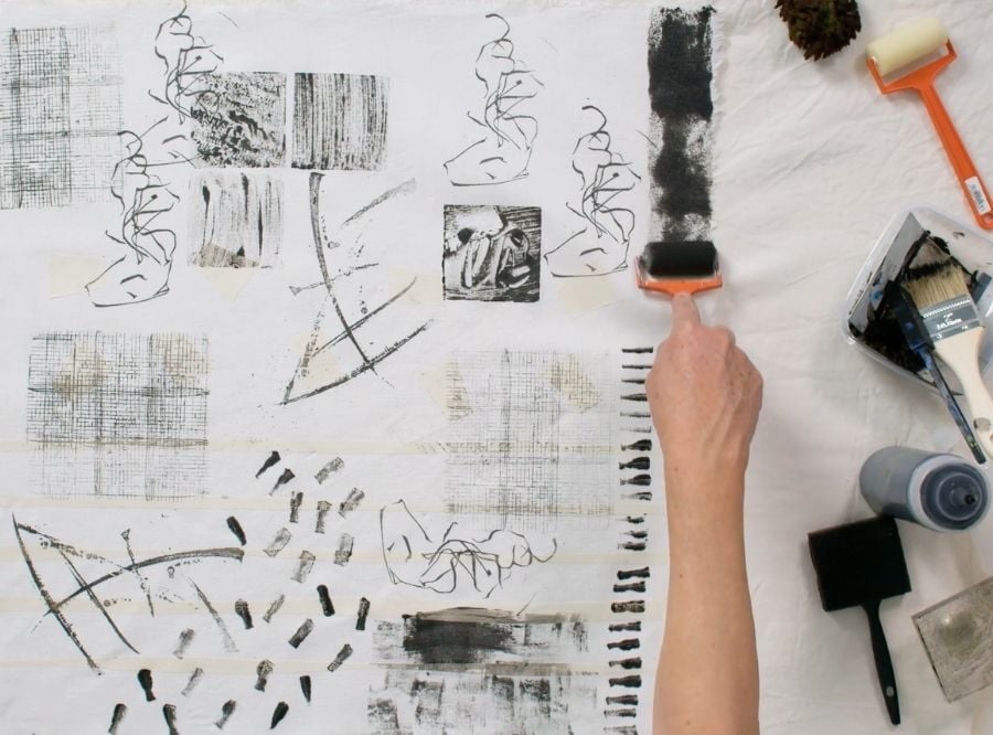 Claire Benn demonstrating how to apply soya paint to cloth