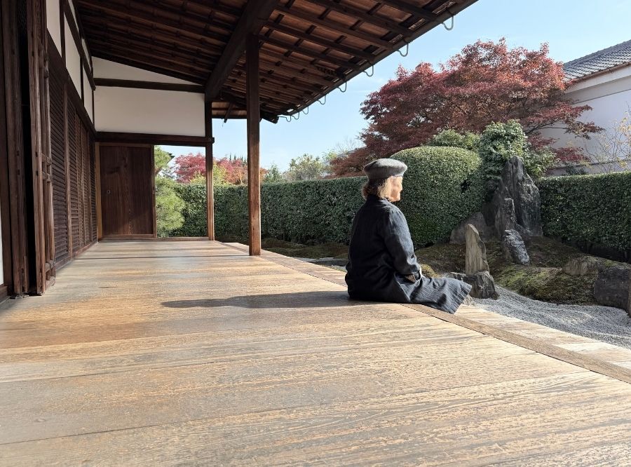Sarah Brayer sitting peacefully on her verandah