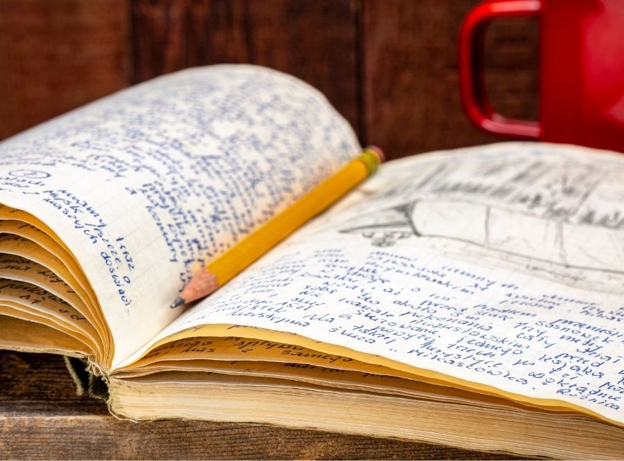 Sketch and notebook open with pencil