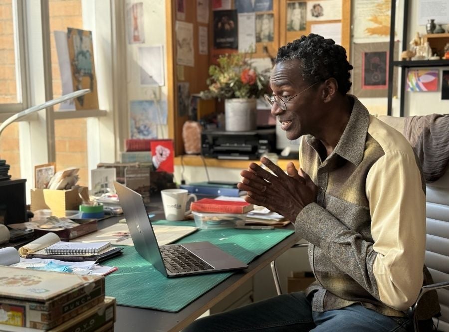 Robert Lee Davis on his laptop