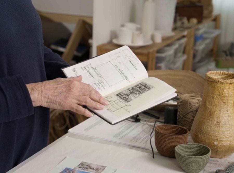 Lissa Hunter going through one of her sketchbooks