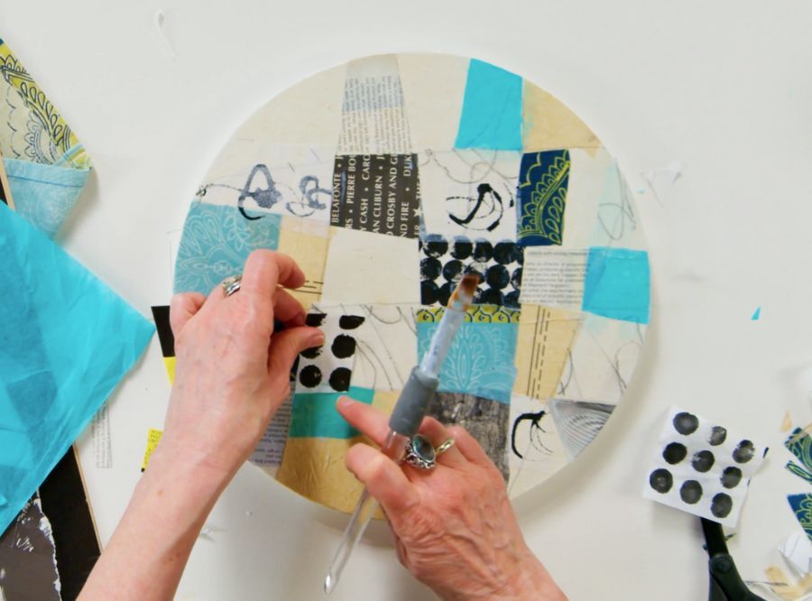Cordula working on a piece during The Art of Abstract Collage