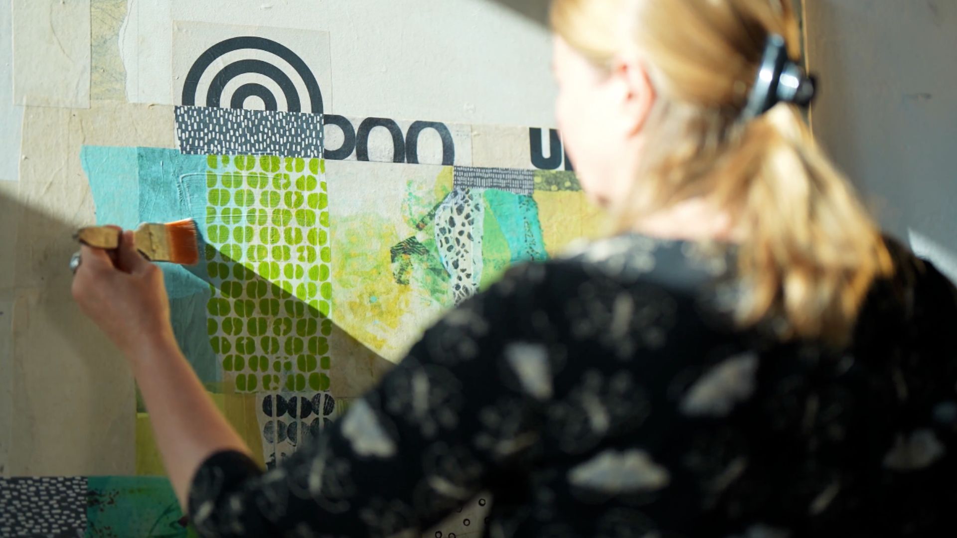 Kagemann working on a collage in her sunlit studio