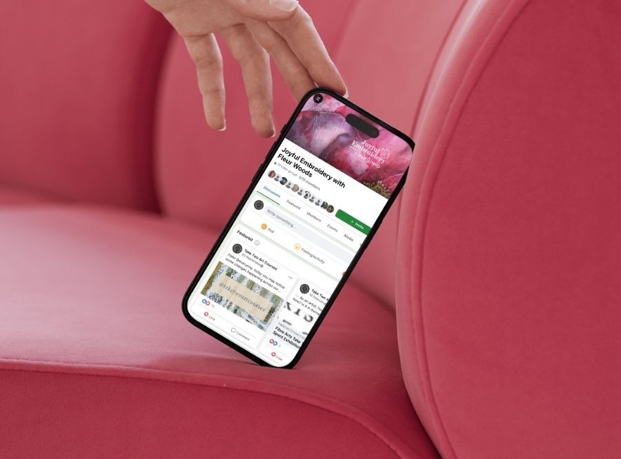 Joyful Embroidery online community shown on mobile phone screen